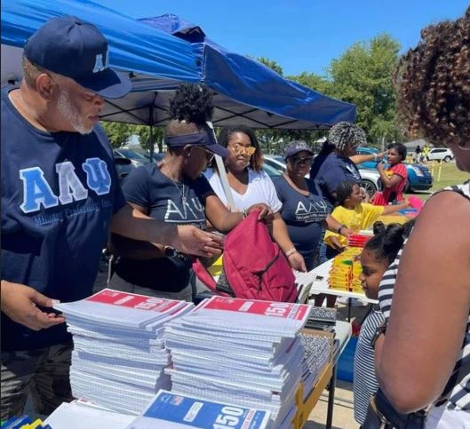 Alpha Lambda Psi members participating in community service